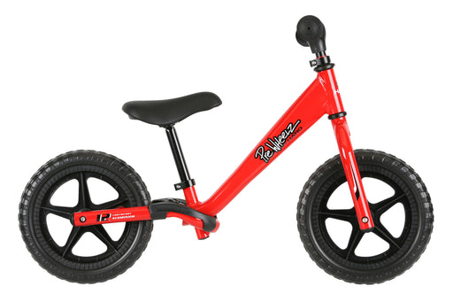 Side view of the Haro PreWheelz push balance bike in red