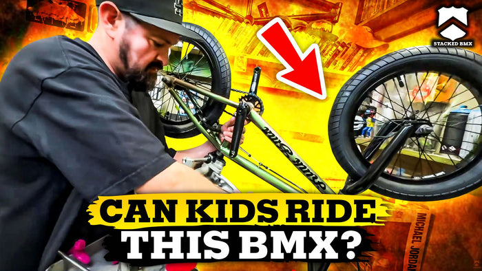 action packed image of stacked bmx shops bicycle mechanic showing you how to build a 16" Kink Carve bmx bike
