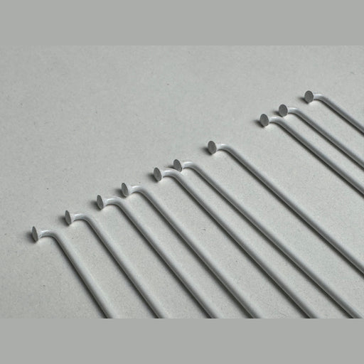 close up of the Stacked Stainless Stainless steel spokes in white, bike wheel spokes