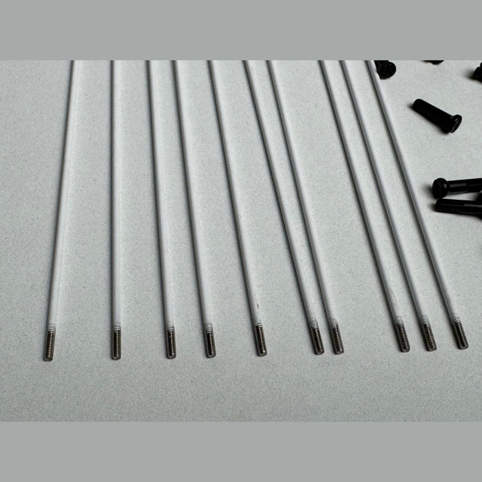 Close up of the Stacked Stainless Steel Spokes in white threads, bmx wheel spokes