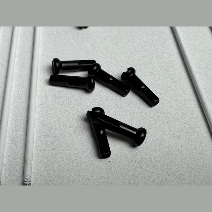 close up of brass Spoke nipples in black, Bicycle wheel spoke nipples 