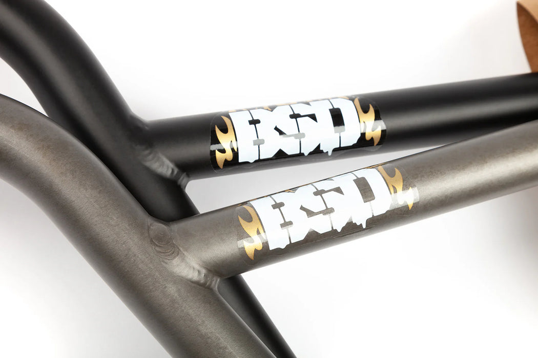 close up view of the BSD High as hell bars in black and raw, How to adjust bicycle handlebars, how to raise bicycle handlebars, how to tighten bicycle handlebars, how to tape bicycle handle bars, how to straighten bicycle handlebars, are bicycle handlebars universal, can bicycle handlebars be raised, how to align bicycle handlebars with front wheel, can you use bicycle handlebars on a motorcycle, what diameter are bicycle handlebars, what are bicycle handlebars attached to, bicycle handlebars universal, 