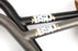 close up view of the BSD High as hell bars in black and raw, How to adjust bicycle handlebars, how to raise bicycle handlebars, how to tighten bicycle handlebars, how to tape bicycle handle bars, how to straighten bicycle handlebars, are bicycle handlebars universal, can bicycle handlebars be raised, how to align bicycle handlebars with front wheel, can you use bicycle handlebars on a motorcycle, what diameter are bicycle handlebars, what are bicycle handlebars attached to, bicycle handlebars universal, 