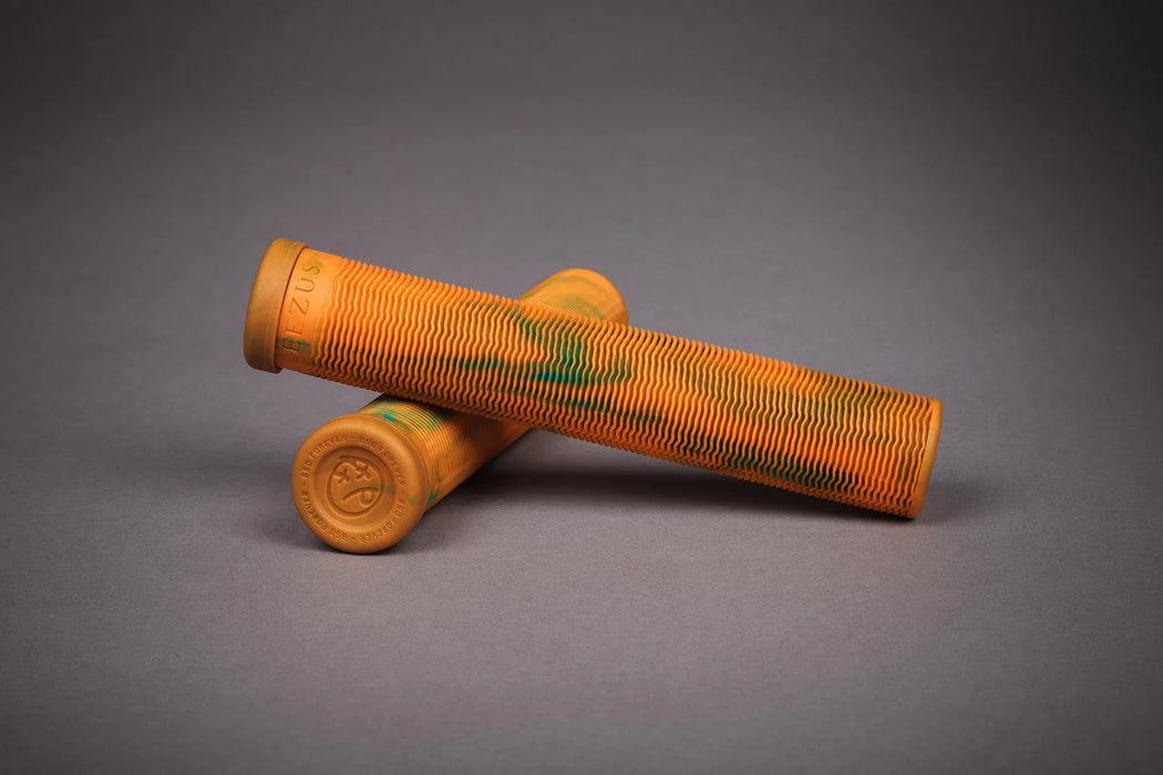 studio photo of the BSD Leezus grips in orange, Mtb grips lock on, mountain bike grips lock on, odi bike grips, odi grips on bike, lock on handlebar grips, get grips, soft mtb grips, yellow bmx grips, soft mountain bike grips, rockbros grips, antique bicycle grips, bicycle handle rubber, bike handle rubber, bike rubber handles, bmx grips yellow, grips rockbros, handlebar rubber, mountain bike bar end grips, mtb bar ends grips, mtb grips soft, retro bicycle grips, retro bike grips, vintage bicycle grips