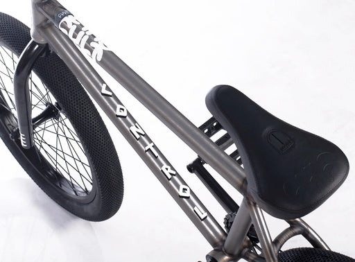 Close up view of the Cult Control bmx bicycle in raw, Cult Control BMX bike with Cult x Vans 2.40 inch tires