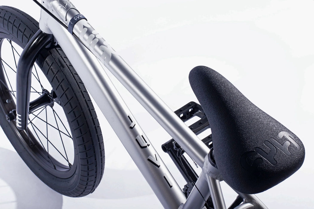 Close up view of the 18" Cult Juvenile complete bike in silver, bmx bike for 9 years old