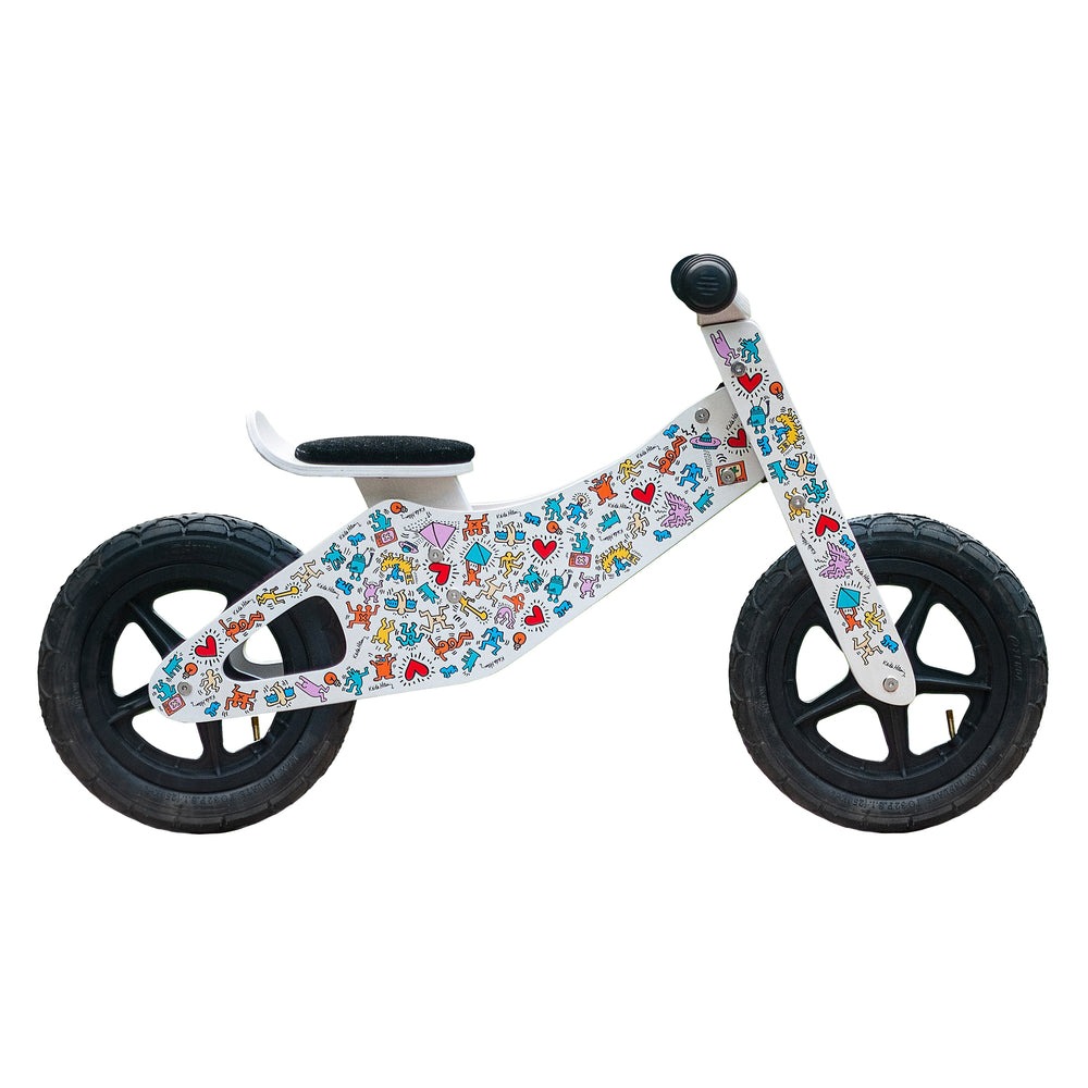 side view of the Keith Haring push bike in white