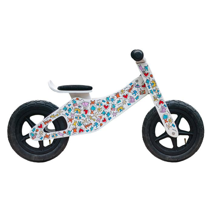 side view of the Keith Haring push bike in white