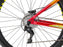 Side view of the orange Mafia thrust rear wheel and derailleur 