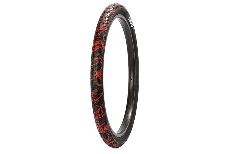 side angle view of method tire in black with red splatter