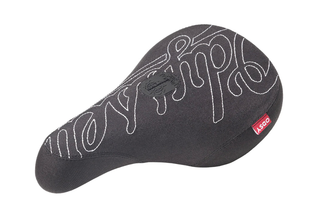 black Odyssey Stitch pivotal seat with white stitching that says Odyssey in cursive and has a red tag that says ODSY.