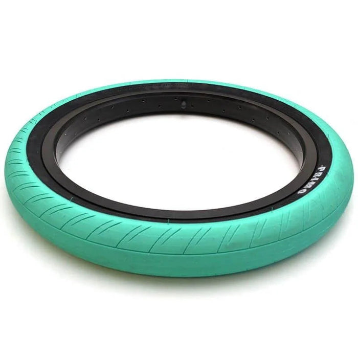 Turquoise Primo Churchill tire with black sidewall on a white background