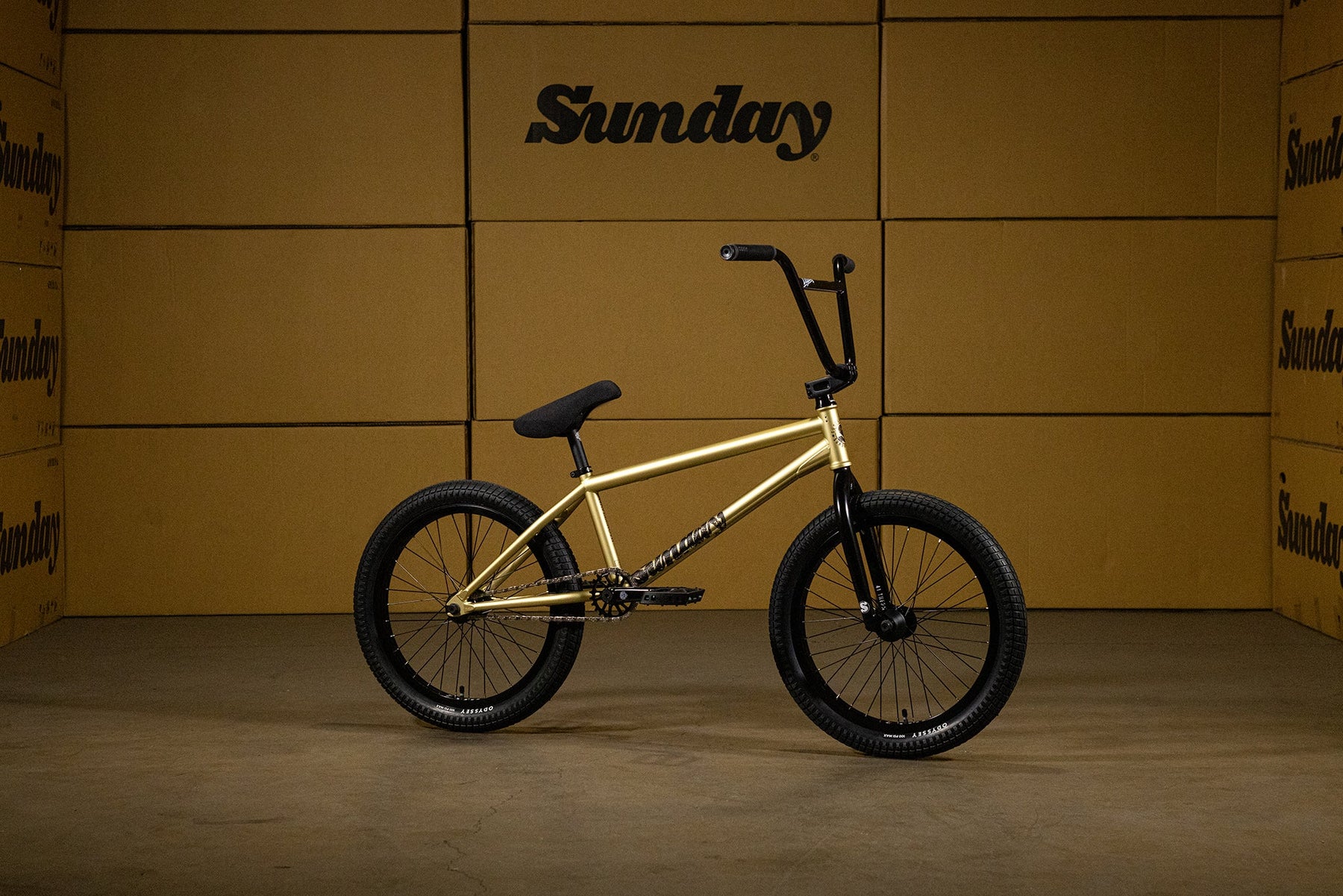 side view of the Sunday Wavelength bmx bike in gold