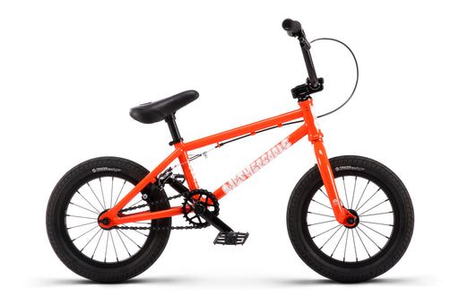 side view of the Wethepeople Riot BMX bike in orange