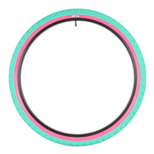 side view of the 29" Rant Squad tire in pink and teal