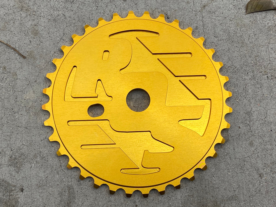 Front view of the Ride out supply ROS Sprocket in Gold, big bmx sprocket